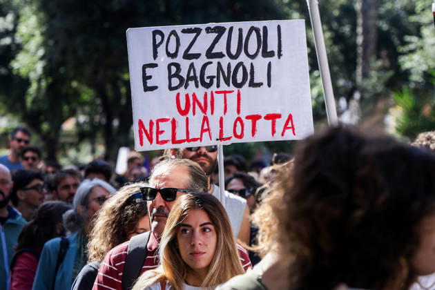 IPA89763014 - NAPLES, ITALY — OCTOBER 16, 2026: Environmental activists, students, and unemployed people take to the streets in the Bagnoli district of Naples to protest the city government’s handling of the environmental remediation of the former Italsider steelworks site. The demonstration focuses on the ongoing redevelopment work in the area, where facilities for the 38th Louis Vuitton America’s Cup—scheduled to take place in Naples in 2027—are being built. Protesters raise concerns about environmental protection, the remediation process, and the project’s impact on the local community.  Copyright: xAntonioxBalasco LiveMediax xAntonioxBalasco LiveMediax IPA89763014