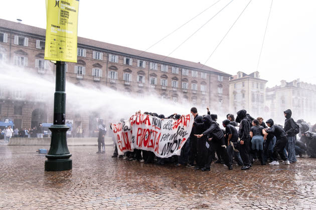 October 16, 2026, Turin, Piedmont, Italy: After days of occupations at many high schools across the city, following the French model, on Friday, October 16, in Turin, thousands of students took to the streets to protest the lack of resources in the school system and the inadequate condition of school buildings. The protesters marched through the city, stopping in front of Porta Susa, where teachers formed a human chain to separate them from the police. Lastly, in Piazza Castello, the police used water cannons and tear gas to disperse the demonstration, which had arrived outside the police headquarters. Turin Italy - ZUMAs377 20261016_znp_s377_039 Copyright: xPietroxStariccox