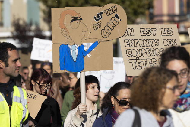 High Cost of Living Protest - Gap A demonstrator carries a caricature beside a placard reading On est les enfants des coupeurs de têtes ! ( We are the children of the head-cutters! ) during the march in Gap, France, on October 17, 2026. Photo by Thibaut Durand ABACAPRESS.COM Gap Provence-Alpes-Cote d Azur France  Copyright: xDurandxThibaut ABACAx