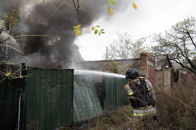 October 17, 2026, Sloviansk, Donetsk Oblast, Ukraine: Emergency services respond following a Russian attack on a residential neighbourhood in Sloviansk, Donetsk Oblast, Ukraine, as firefighters work to extinguish a blaze at a damaged house. Residents continue their daily lives amid the ongoing war. Sloviansk Ukraine  - ZUMAm350 20261017_zip_m350_010 Copyright: xCameronxJones-Manleyx