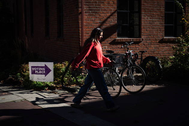 October 17, 2026, Port Moody, Bc, CANADA: A woman walks past a sign directing people to a polling station in Vancouver, on Saturday Oct. 17, 2026. British Columbians are heading to the polls to cast their votes in municipal elections being held across the province. Port Moody CANADA  - ZUMAc35_ 20261017_zaf_c35_021 Copyright: xEthanxCairnsx