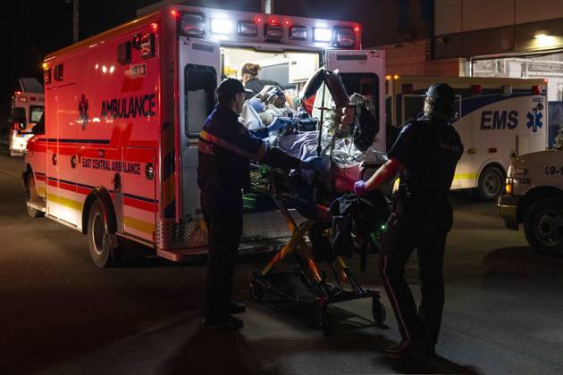 October 17, 2026, Wainwright, Alberta, Canada: Paramedics load an injured person into an ambulance at the Wainwright Health Centre as injured military members are treated after a fire at CFB Wainwright, outside of Wainwright, Alta., on Saturday, Oct. 17, 2026. Wainwright Canada  - ZUMAc35_ 20261017_zaf_c35_156 Copyright: xJohnxUlanx