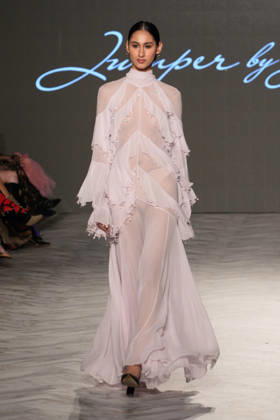 (261018) -- VANCOUVER, Oct. 18, 2026 -- A model presents a creation by Chinese fashion designer Jumper Zhang during Vancouver Fashion Week 2026 in Vancouver, British Columbia, Canada, on Oct. 17, 2026. (Photo by Liang Sen Xinhua) CANADA-VANCOUVER FASHION WEEK 2026 LinxWei 
