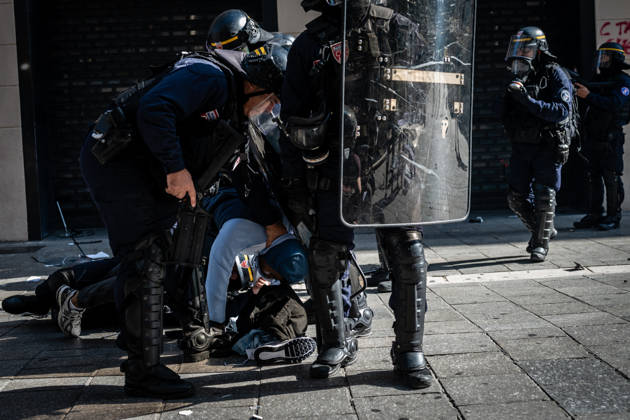 Clashes during The High Cost of Living Protest - Marseille Police officers lead away a protester after arresting him during a store looting in Marseille, France, on October 17, 2026 during clashes at the High Cost of Living Protest - Marseille. Photo by Laurent Coust ABACAPRESS.COM Marseille France  Copyright: xCoustxLaurent ABACAx