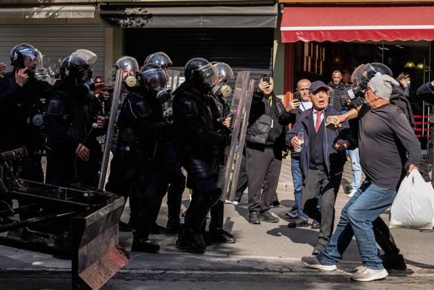 October 18, 2026, Tirana, Albania: TIRANA, ALBANIA, OCTOBER 18, 2026: Demonstrators clash with riot police outside the Ministry of Education in Tirana as student-led anti-government protests continue for a sixth consecutive day. Protesters throw stones while police respond with tear gas, water cannons and rubber bullets. The demonstrations demand improved university conditions and the resignation of Prime Minister Edi Rama. Tirana Albania  - ZUMAq101 20261018_zna_q101_065 Copyright: xVlasovxSulajx