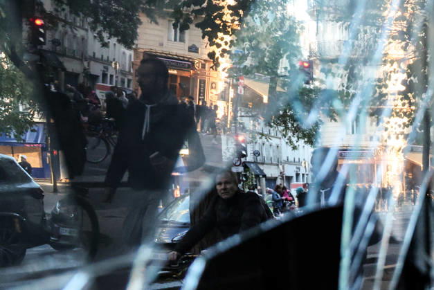 (261018) -- PARIS, Oct. 18, 2026 -- People walk past a shop damaged during a protest in Paris, France, Oct. 18, 2026. French President Emmanuel Macron on Sunday vowed legal action against those responsible for violence during protests across the country on Saturday. ) FRANCE-PARIS-PROTEST-VIOLENCE WuxHuiwo