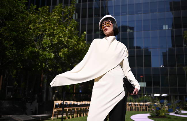 MELBOURNE FASHION WEEK PREVIEW, A guest poses for a photo ahead of a 2026 Melbourne Fashion Week Runway Preview, at Sky Park, Melbourne, Monday, October 19, 2026. The preview features a selection of the upcoming collections that will appear on M FW runways including designers OUT OF HAND x Lisa Waup, Ebony Noire, Van Ermel Scherer, Perple, Gotham, Wilson Jedd Adams, Asiyam, Atoir, NGALI, Kuwaii, HoMie, Collective Closets x Mariam Farah, TOJHÃÄ, Amy Cottrell, BAAQIY and Sean Rentero. ( NO ARCHIVING MELBOURNE VICTORIA Australia Copyright: xJOELxCARRETTx 20261019180608211848