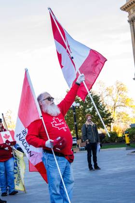 October 18, 2026, Edmonton, Alberta, Canada: A supporter displays their Canadian flags at the Alberta Federation of Labour s Canada Unity Rally ahead of the Alberta Referendum..With less than 24 hours until Referendum voting starts, the Alberta Federation of Labour and Fight Back supporters rallied at the Alberta Legislature grounds to support a Unified Alberta in Canada and oppose the prospect of separation from Canada. The group is opposed to the 9 other questions on the Alberta referendum ballots. Edmonton Canada - ZUMAs197 20261018_aaa_s197_662 Copyright: xRonxPalmerx