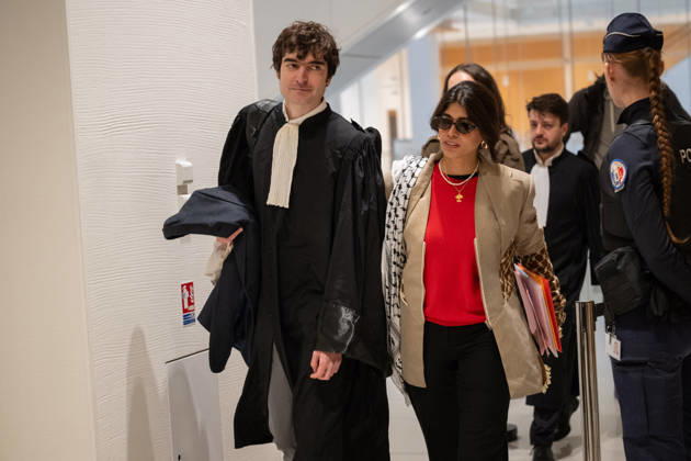 Rima Hassan Trial - Paris AJ www.alexisjumeau.comMEP Rima Hassan, wearing a keffiyeh draped over her shoulders (a symbol of the Palestinian people’s struggle), accompanied by her lawyer, Maitre Vincent Brengarth, walks towards the courtroom, Trial of Rima Hassan, MEP for the La France Insoumise (LFI) movement (a left-wing opposition political party), on charges of glorifying terrorism following a tweet featuring a photograph of Kozo Okamoto repeating a message about the need for armed struggle for the Palestinian cause and Palestine’s war with Israel, in the courtroom of the Paris Criminal Court, France on October 19, 2026. Photo by Alexis Jumeau ABACAPRESS.COM Paris France Copyright: xJumeauxAlexis ABACAx