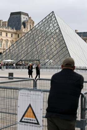 (261019) -- PARIS, Oct. 19, 2026 -- Protesters gather in front of an entrance to the Louvre Museum in Paris, France, Oct. 19, 2026. In Paris, the entrance to the Louvre Museum was blocked by student protesters on Monday morning, French daily Le Parisien reported, citing the museum s management and two trade unions. According to the trade union General Confederation of Labour, the museum would remain closed at least until noon. ) FRANCE-PARIS-LOUVRE MUSEUM-PROTEST WuxHuiwo 