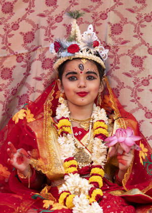 October 19, 2026, Guwahati, Assam, India: A young girl participates in the Kumari Puja ritual as part of the annual Durga Puja Festival at the Ram Krishna Mission in Guwahati, India. Kumari Puja is a Hindu tradition observed during Durga Puja, Basanti Puja, and Navratri, in which young girls aged one to sixteen are worshipped as living embodiments of the Goddess; the ritual symbolises purity, divine feminine power, and spiritual devotion. Guwahati India  - ZUMAt232 20261019_zip_t232_002 Copyright: xDavidxTalukdarx