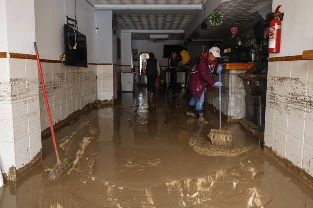 The Valencian Regional Government is preparing a lockdown order for the southern coast of Valencia and the northern coast of Alicante due to the rains. Several people are clearing mud from the streets while furniture they had to remove due to flooding caused by the heavy rains piles up, on October 19, 2026, in Els Poblets, Valencian Community, Spain. The Valencian Regional Government is preparing a lockdown order for the southern coast of Valencia and the northern coast of Alicante in response to the emergency declared due to the rains brought by Storm Adam, as announced by the Regional Minister of Emergencies and the Interior early this morning, October 19, from the Emergency Coordination Center (CCE) October 19, 2026, Valencia, Valencian Copyright: xRoberxSolsonax 7855648