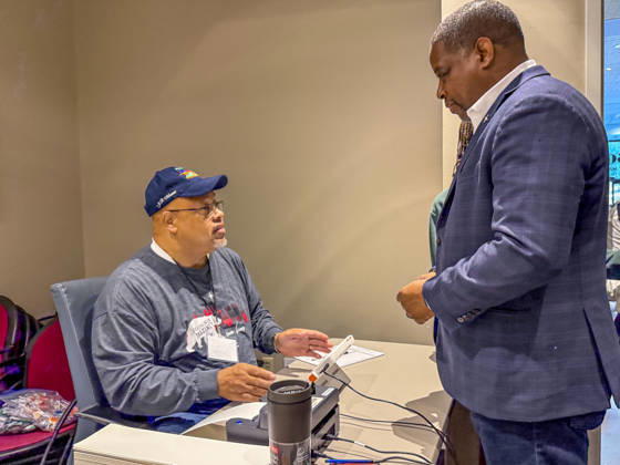 October 19, 2026, Little Rock, Arkansas, USA: Poll worker JERRY SAXTON checks in Democratic Congressional candidate CHRIS JONES so he can cast his ballot on the first day of early vote in Arkansas. Jones is running for the seat now held by Rep. French Hill (R-AR). Should Jones win, he will be the first Black person Arkansas sends to Congress. Little Rock USA - ZUMAd155 20261019_znp_d155_025 Copyright: xSuexDorfmanx