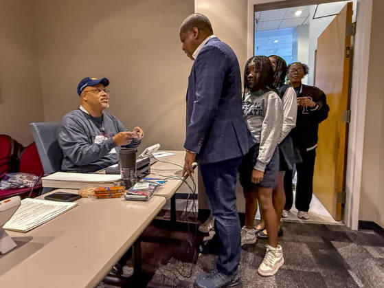 October 19, 2026, Little Rock, Arkansas, USA: Poll worker JERRY SAXTON checks the voter ID of Democratic Congressional candidate CHRIS JONES so he can cast his ballot on the first day of early vote in Arkansas. Jones is running for the seat now held by Rep. French Hill (R-AR). Should Jones win, he will be the first Black person Arkansas sends to Congress. Little Rock USA - ZUMAd155 20261019_znp_d155_026 Copyright: xSuexDorfmanx