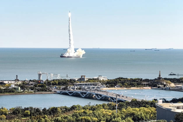 RIZHAO, CHINA - OCTOBER 21: The Ceres-1 sea launch vehicle lifts off from the sea area near Lighthouse Scenic Area on October 21, 2026 in Rizhao, Shandong Province of China. This mission marks the first time a sea launch has been commanded from land in China, utilizing a land-based command center in Rizhao to coordinate the process. The rocket successfully delivered the Xiguang Si-01 satellite into its predetermined orbit.  Copyright: xVCGx 111675990602
