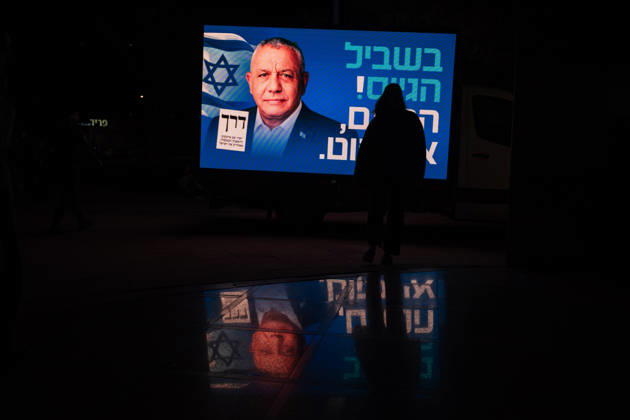 October 20, 2026, Be er Sheva, New York, Israel: A person walks by a sign bearing the likeness of GADI EISENKOT the leading candidate to replace PM Benjamin Netanyahu in the upcoming Israeli elections, at a campaign rally of his party Yashar in Be™er Sheva. Be er Sheva Israel - ZUMAg280 20261020_znp_g280_003 Copyright: xYoavxGinsburgx