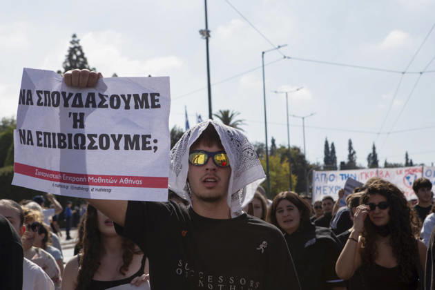 Athens Greece Living Costs Protest A protester holds a placard reading Should We Study or Survive during a rally in Athens, Greece on October 21, 2026. Students and other demonstrators marched through central Athens to protest rising living costs and economic pressures. Organizers say the concerns raised by participants echo grievances voiced during recent demonstrations in France. Athens Attica Greece Copyright: xElvisxTakahashixMantellox