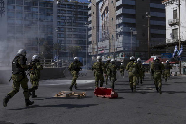 Athens Greece Living Costs Protest Riot police move across a street as smoke rises during a protest in Athens, Greece on October 21, 2026. Students and other demonstrators marched through central Athens to protest rising living costs and economic pressures. Organizers say the concerns raised by participants echo grievances voiced during recent demonstrations in France. Athens Attica Greece Copyright: xElvisxTakahashixMantellox