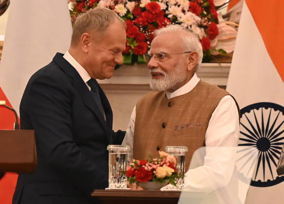 NEW DELHI, INDIA - OCTOBER 22: Prime Minister Narendra Modi (R) speaks with Prime Minister of Poland Donald Tusk (L) during a joint press statement following delegation-level bilateral talks at Hyderabad House on October 22, 2026 in New Delhi, India. The high-level meeting marked Polish Prime Minister Tusk s official visit to India from October 21-23, 2026 his first visit to the country as Prime Minister since 2010 aimed at advancing the India-Poland Strategic Partnership and deepening India-EU strategic ties. During wide-ranging discussions, both leaders reviewed bilateral cooperation across key sectors including trade, technology, defense-industrial collaboration, and energy, while reaffirming joint commitment toward peaceful diplomatic s