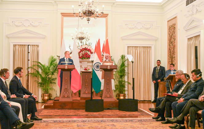 NEW DELHI, INDIA - OCTOBER 22: Prime Minister Narendra Modi (R) and Prime Minister of Poland Donald Tusk (L) address a joint press statement following delegation-level bilateral talks at Hyderabad House on October 22, 2026 in New Delhi, India. The high-level meeting marked Polish Prime Minister Tusk s official visit to India from October 21-23, 2026 his first visit to the country as Prime Minister since 2010 aimed at advancing the India-Poland Strategic Partnership and deepening India-EU strategic ties. During wide-ranging discussions, both leaders reviewed bilateral cooperation across key sectors including trade, technology, defense-industrial collaboration, and energy, while reaffirming joint commitment toward peaceful diplomatic solution