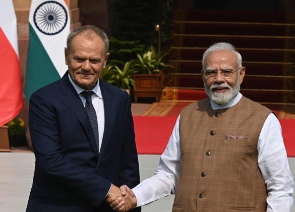 NEW DELHI, INDIA - OCTOBER 22: Prime Minister Narendra Modi (R) welcomes Prime Minister of Poland, Donald Tusk (L), prior to their delegation-level bilateral meeting and joint press statement at Hyderabad House on October 22, 2026 in New Delhi, India. The high-level meeting marked Polish Prime Minister Tusk s official visit to India from October 21-23, 2026 his first visit to the country as Prime Minister since 2010 aimed at advancing the India-Poland Strategic Partnership and deepening India-EU strategic ties. During wide-ranging discussions, both leaders reviewed bilateral cooperation across key sectors including trade, technology, defense-industrial collaboration, and energy, while reaffirming joint commitment toward peaceful diplomatic