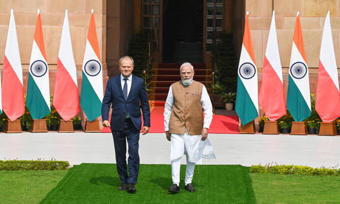 NEW DELHI, INDIA - OCTOBER 22: Prime Minister Narendra Modi (R) welcomes Prime Minister of Poland, Donald Tusk (L), prior to their delegation-level bilateral meeting and joint press statement at Hyderabad House on October 22, 2026 in New Delhi, India. The high-level meeting marked Polish Prime Minister Tusk s official visit to India from October 21-23, 2026 his first visit to the country as Prime Minister since 2010 aimed at advancing the India-Poland Strategic Partnership and deepening India-EU strategic ties. During wide-ranging discussions, both leaders reviewed bilateral cooperation across key sectors including trade, technology, defense-industrial collaboration, and energy, while reaffirming joint commitment toward peaceful diplomatic