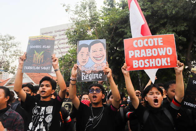 October 22, 2026, Surabaya, East Java, Indonesia: Demonstrators hold up posters during a protest in front of the Gedung Negara Grahadi in Surabaya, East Java, Indonesia, on October 22, 2026. The students demand accountability from the central and regional governments, alleging that both have failed to fulfill their political promises. Their demands include upholding civil supremacy, ending military involvement in the civil sphere, canceling the Free Nutritious Meal (MBG) program and the Red and White Village Cooperatives, and restoring the 20 percent education budget allocation as mandated by the constitution. They also request that forest and land fires (karhutla) be designated a national disaster. The protesters call for Prabowo Subianto - ZUMAp290 20261022_zip_p290_013 Copyright: xRendyxAgungxPrakosox