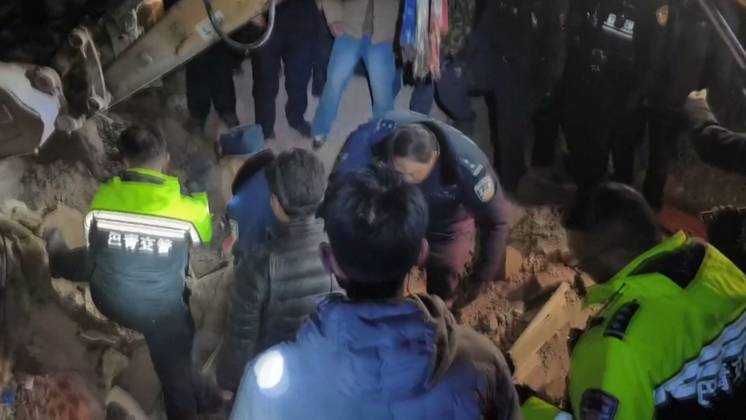 NAGQU, CHINA - OCTOBER 23: This screen grab made from the CCTV+ footage released on October 23, 2026 shows rescuers searching through ruins with flashlight after a 7.0-magnitude earthquake on October 23, 2026 in Nagqu, Xizang Autonomous Region of China. At least 16 people have been killed and 11 seriously injured as of 05:20 on Friday after a 7.0-magnitude earthquake hit southwest China s Xizang Autonomous Region on Thursday night, according to Nagqu City s earthquake relief headquarters.  Copyright: xVCGx 111676447832