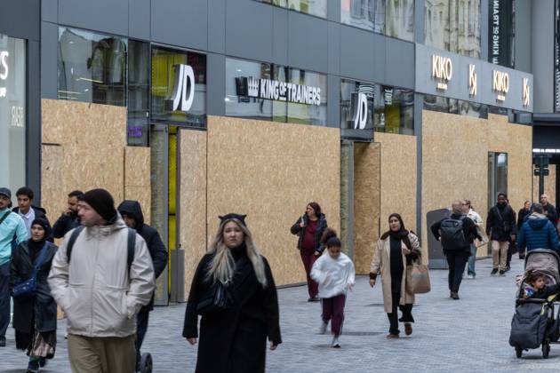 Storefronts boarded up with wooden panels at Rue Neuve Nieuwstraat, in Brussels, on Friday 23 October 2026. Stores are preparing for another protest scheduled for Saturday.  NICOLASxMAETERLINCK 190739845