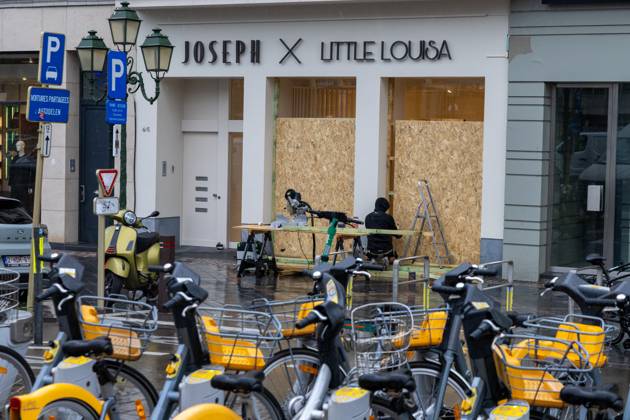 Storefronts boarded up with wooden panels, in Brussels, on Friday 23 October 2026. Stores are preparing for another protest scheduled for Saturday.  NICOLASxMAETERLINCK 190744561