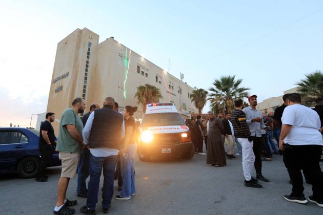 (261023) -- KARAK, Oct. 23, 2026 -- People gather outside a hospital in Karak after a shooting attack in Jordan s southern governorate of Karak, Oct. 23, 2026. Seven people were killed and 34 others injured in a shooting attack during a funeral in Jordan s southern governorate of Karak, the Jordanian Public Security Directorate said Friday. (Photo by Xinhua) JORDAN-KARAK-CHURCH SHOOTING MohammadxAbuxGhosh 