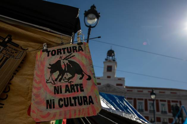 October 23, 2026, Madrid, Spain: A banner featuring the phrase tortureÃ¢â‚¬neither art nor culture and an image of a bull can be seen at Puerta del Sol..Tents remain set up by housing rights activists, who organized the occupation of the square in response to the eviction of MaricarmenÃ¢â‚¬a woman in her eightiesÃ¢â‚¬from her home, carried out by a real estate investment fund. Madrid Spain  - ZUMAs197 20261023_aaa_s197_155 Copyright: xDavidxCanalesx