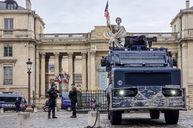 FRANCE, PARIS - OCTOBER 24, 2026: Police officers and vehicle are on guard at the National Assembly building as mass protests involving trade unions and university students are expected in the French capital. Dmitry Orlov TASS  99860317