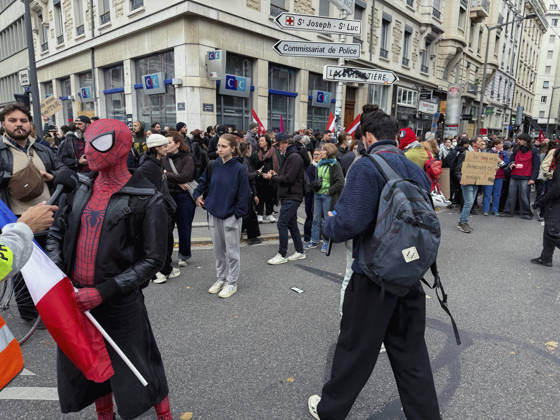 Lyon France Anti-Government Protest A demonstrator wearing a Spider-Man mask holds a French flag as protesters gather on a street in Lyon, France, on October 24, 2026. The demonstration took place amid renewed protests over living costs, wages and public services, while authorities restricted gatherings in parts of central Lyon following unrest during demonstrations the previous weekend. Lyon Rhone Alpes France Copyright: xAbolfazlxSalmanzadehx