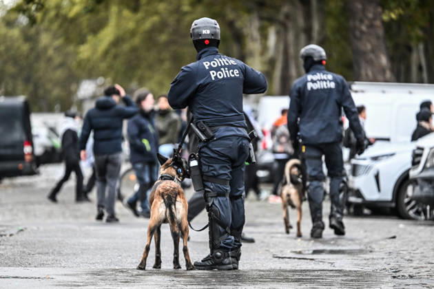 Riot police officers accompanied by police dogs confront and disperse crowds during student protests in central Brussels, Belgium, on 24 October 2026. Police repeatedly drive groups of demonstrators, including minors and adults, apart through streets and avenues between Avenue Lemonnier and Brussels-South railway station.