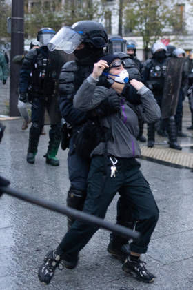 Yellow Vests Protest Act II - Paris RL Police forces arrest a protester by doing a choke valve (clé d’étranglement) at the porte de Vincennes at the end of a demonstration in favor of purchasing power, the protection of public services, and fiscal and social justice, in Paris on October 24, 2026 as part of a nationwide call for mobilisation and protest bringing together former members of the Yellow Vest movement, labor unions, high school and university students. Photo by Raphael Lafargue ABACAPRESS.COM Paris France  Copyright: xLafarguexRaphael ABACAx