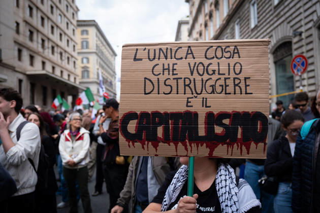 October 24, 2026, Rome, Rm, Italy: Thousands of people take to the streets to join the Get Italy out of the war march. Participants are calling for peace and protesting against the rising cost of living. The only thing I want to destroy is capitalism reads the sign. Rome Italy - ZUMAg256 20261024_znp_g256_005 Copyright: xMarcoxDixGianvitox