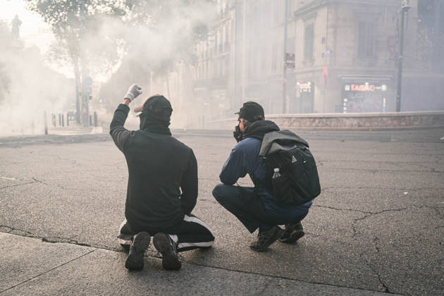 Marseille France Street Protests Demonstrators crouch amid smoke during a protest in Marseille, France on October 24, 2026. Authorities deployed around 70,000 security personnel across France for renewed protests over the cost of living, after unrest a week earlier saw public buildings damaged, hundreds of shops looted and about 2,700 people arrested. Marseille Provence-Alpes-CÃ te France Copyright: xNaelxChahinex
