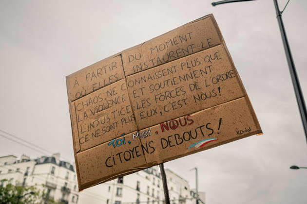 Yellow Vests Protest Act II - Paris Demonstrators carry placards displaying political messages during a march against the rising cost of living and for social justice in Paris, France, on October 24, 2026. The protest follows the boulevards des Maréchaux from Porte d’Italie to Porte de Vincennes, with calls for higher wages and better funding for public services and education. Photo by Jules Bernard ABACAPRESS.COM Paris Île-de-France France  Copyright: xBernardxJules ABACAx