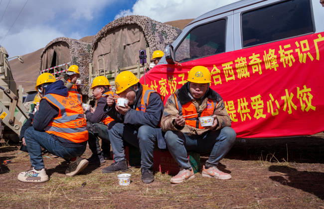 (261025) -- BAQEN, Oct. 25, 2026 -- Rescuers eat dumplings at a temporary shelter in Maru Township of Baqen County, Nagqu City, southwest China s Xizang Autonomous Region, Oct. 24, 2026. After a 7.0-magnitude earthquake struck Baqen County in Nagqu, southwest China s Xizang Autonomous Region, on Thursday, Du Guoping, owner of a dumpling restaurant in Xigaze, postponed the opening of his two new restaurants and headed to the disaster zone with his staff. It took only about 10 minutes to make the decision that we would go to Baqen and cook dumplings for earthquake-affected residents, Du said. The team loaded more than 1,500 kilograms of dumplings onto vehicles and set off from Xigaze at midnight on the night of the earthquake. Upon