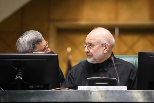 October 25, 2026, Tehran, Iran: Mohammad Bagher Ghalibaf turns toward a gray-haired man speaking to him from behind a computer monitor at the Islamic Consultative Assembly in Tehran, Iran, on October 25, 2026. Parliamentary reports said more than two-thirds of lawmakers joined the October 25 open sitting of the Islamic Consultative Assembly, attending either in person or remotely. Tehran Iran - ZUMAi98_ 20261025_zih_i98_078 Copyright: xIcanax
