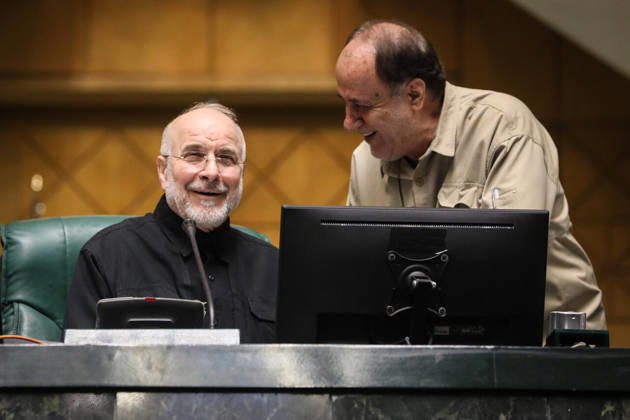 October 25, 2026, Tehran, Iran: Mohammad Bagher Ghalibaf smiles from the speaker s green chair as a beige-shirted man bends toward him at the Islamic Consultative Assembly in Tehran, Iran, on October 25, 2026. Parliamentary reports said more than two-thirds of lawmakers joined the October 25 open sitting of the Islamic Consultative Assembly, attending either in person or remotely. Tehran Iran - ZUMAi98_ 20261025_zih_i98_079 Copyright: xIcanax