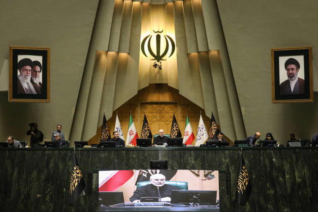 October 25, 2026, Tehran, Iran: Mohammad Bagher Ghalibaf sits at the raised dais beneath Iran s national emblem, with two framed portraits and flags at the Islamic Consultative Assembly in Tehran, Iran, on October 25, 2026. Speaker Mohammad Bagher Ghalibaf chaired the October 25 session, which combined physical attendance at the Islamic Consultative Assembly with participation by video link. Tehran Iran - ZUMAi98_ 20261025_zih_i98_102 Copyright: xIcanax