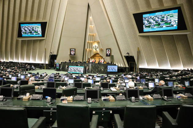 October 25, 2026, Tehran, Iran: Two screens high on the walls display the ongoing sitting above the widely spaced parliamentary seating at the Islamic Consultative Assembly in Tehran, Iran, on October 25, 2026. The Islamic Consultative Assembly resumed an open sitting in its Tehran chamber with a mix of in-person and remote participation, according to parliamentary reporting. Tehran Iran - ZUMAi98_ 20261025_zih_i98_107 Copyright: xIcanax