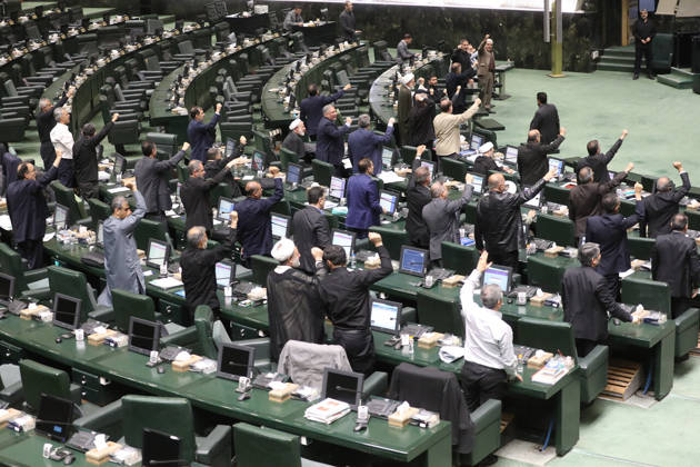 October 25, 2026, Tehran, Iran: A section of the chamber s curved seating shows numerous lawmakers raising their hands over their desk monitors at the Islamic Consultative Assembly in Tehran, Iran, on October 25, 2026. The Islamic Consultative Assembly resumed an open sitting in its Tehran chamber with a mix of in-person and remote participation, according to parliamentary reporting. Tehran Iran - ZUMAi98_ 20261025_zih_i98_122 Copyright: xIcanax